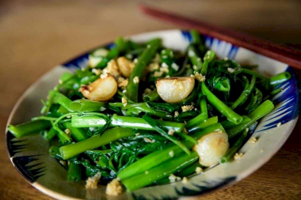 Stir-fried morning glory with garlic is a beloved vietnamese side dish